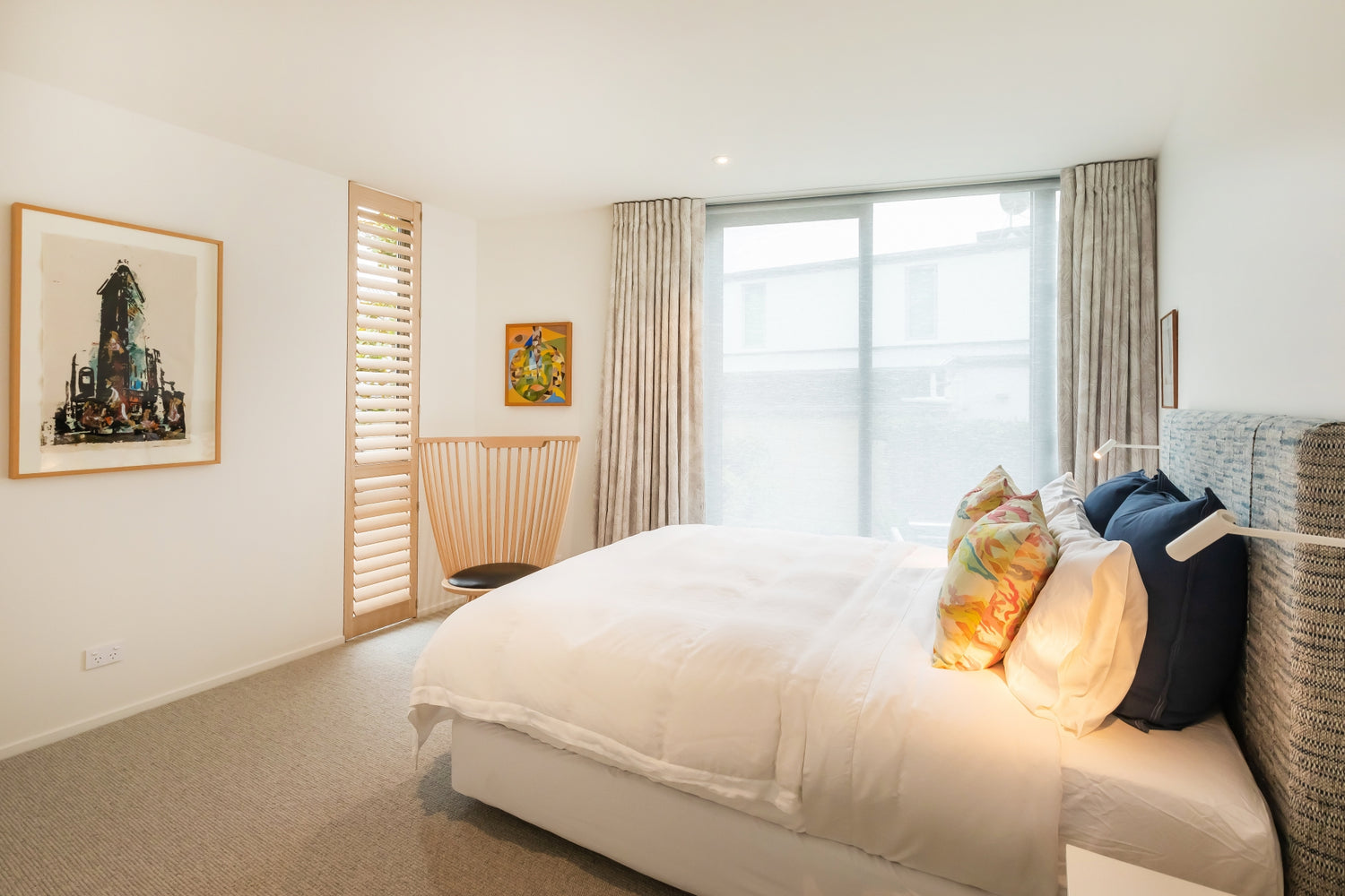 limed oak sante fe shutter in guest bedroom with beatiful romo curtains by Designsupplyco