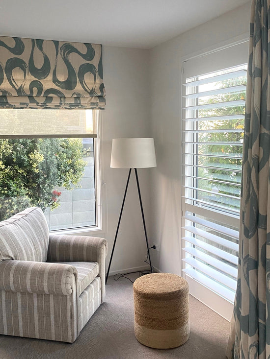 Jim Thompson roman blind and curtain over a sante fe sunscreen and shutter