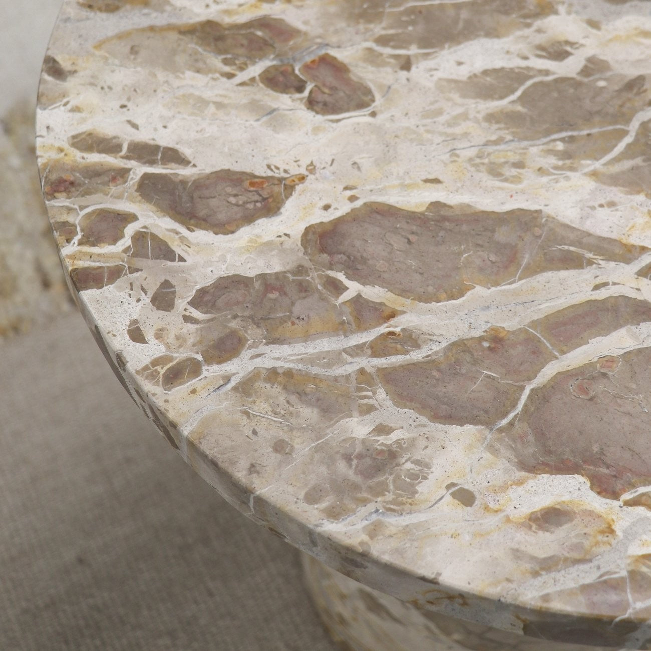 marble beige round table close up