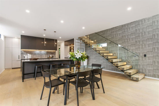 dining room and kitchen space dark colours with light wood floor