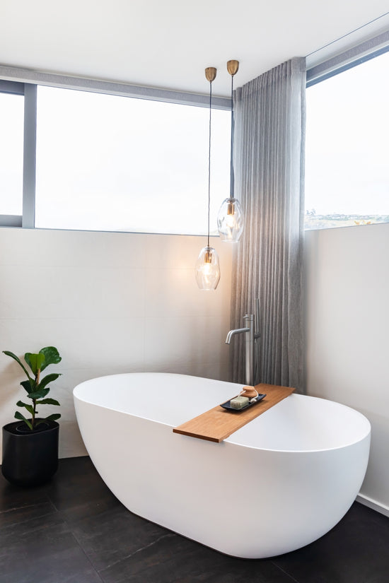 bath with curtain behind