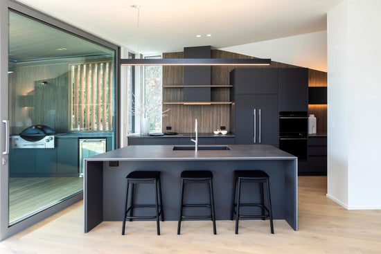 dekton kitchen benchtop with dark cupboards