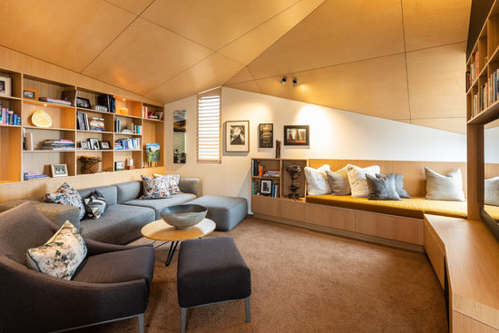 living space with comfortable chairs and wood ceiling