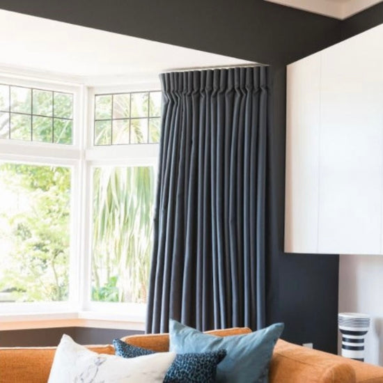 Navy blue curtain in traditional home with leadlight windows.New york pleat. Design and SupplyCo